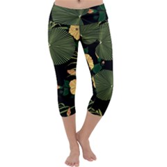 Tropical Vintage Yellow Hibiscus Floral Green Leaves Seamless Pattern Black Background  Capri Yoga Leggings by Sobalvarro